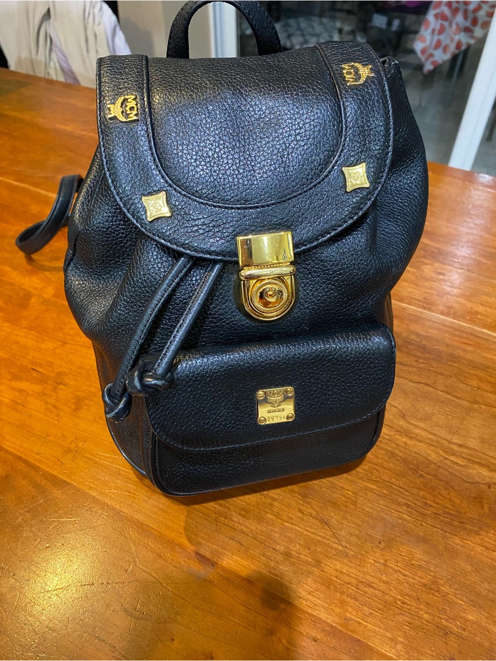 MCM Black Leather Backpack with Gold Logo Plate